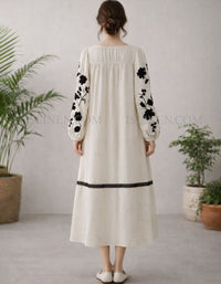 Floral embroidered dress with long sleeves and relaxed fit back view