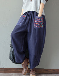Front view of loose floral patch pockets linen harem pants for women