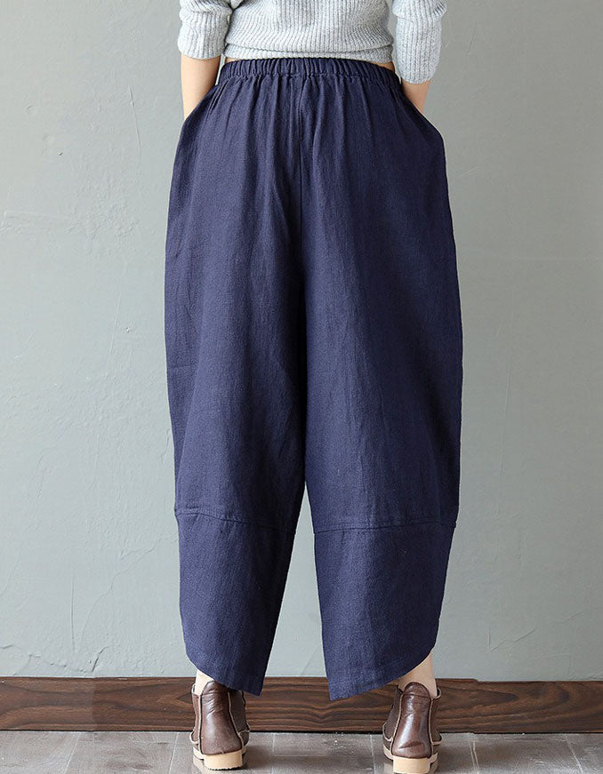 Back view of navy blue loose floral patch pockets linen harem pants for women