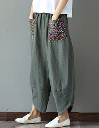 Front view of loose floral patch pockets linen harem pants for women