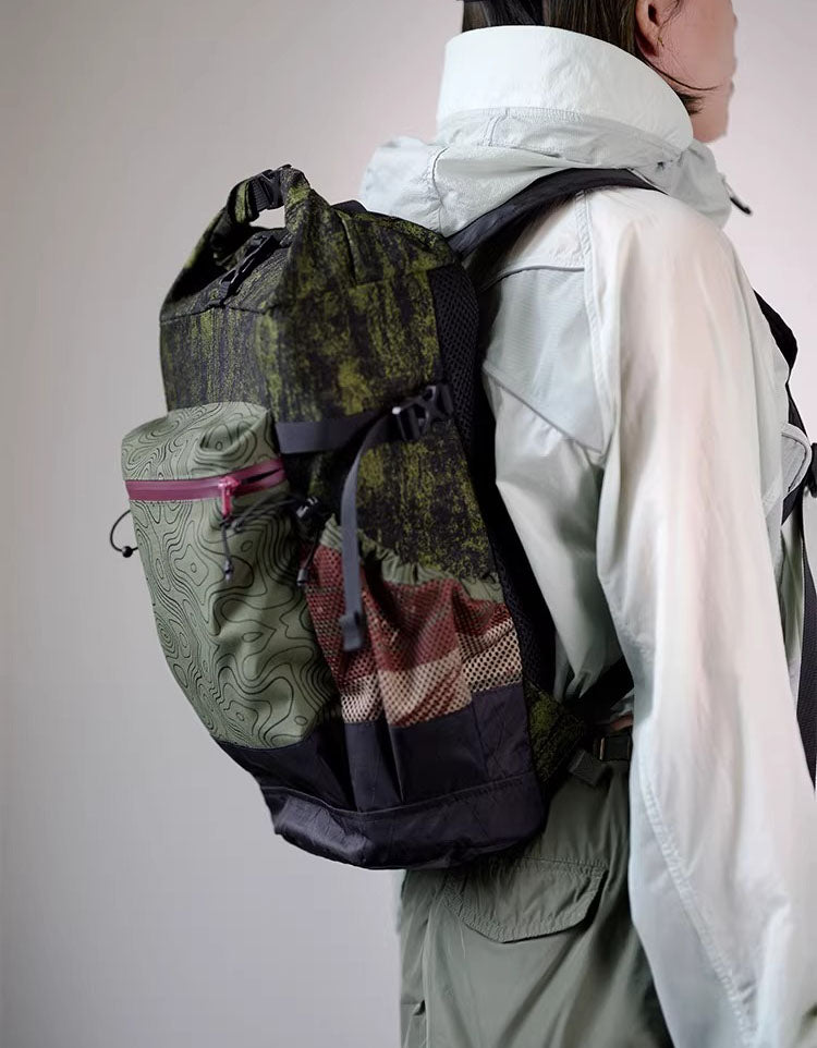 Open roll top backpack showing spacious main compartment and internal storage.
