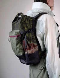 Open roll top backpack showing spacious main compartment and internal storage.