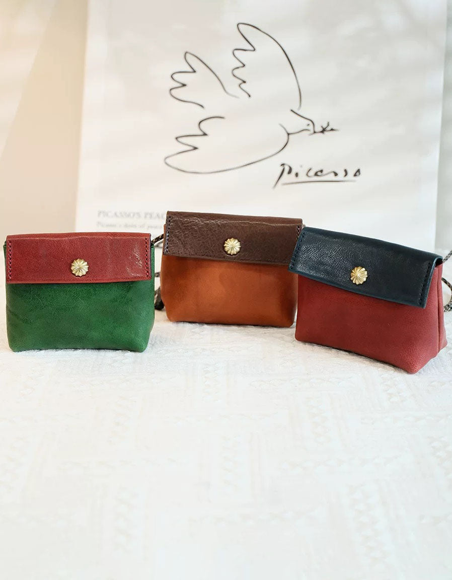 Retro leather small shoulder purse styled with casual striped knit top and shorts