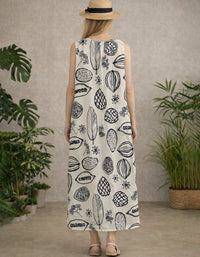 Back view of loose fit cream maxi dress with navy graphic print, sleeveless and ankle length.