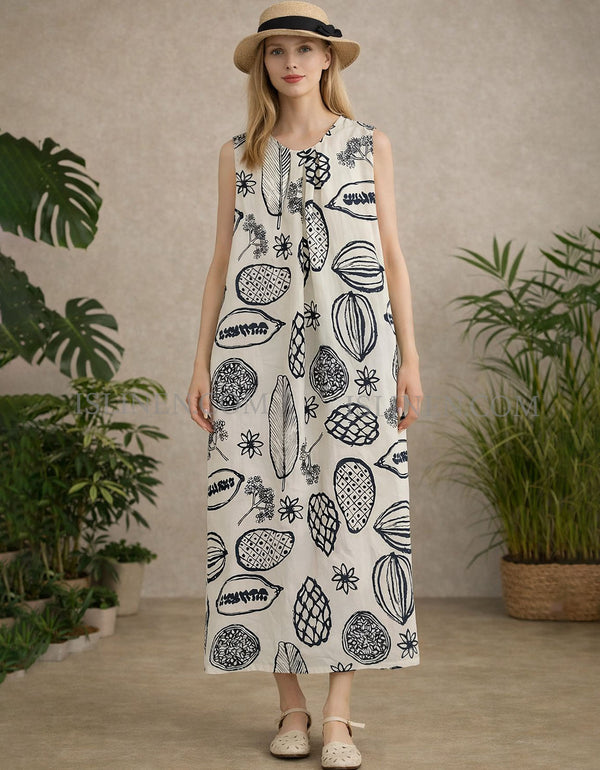 Sleeveless cream maxi dress with bold navy botanical print and loose straight fit, front view on model.