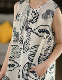 Person wearing a white scarf with black abstract patterns