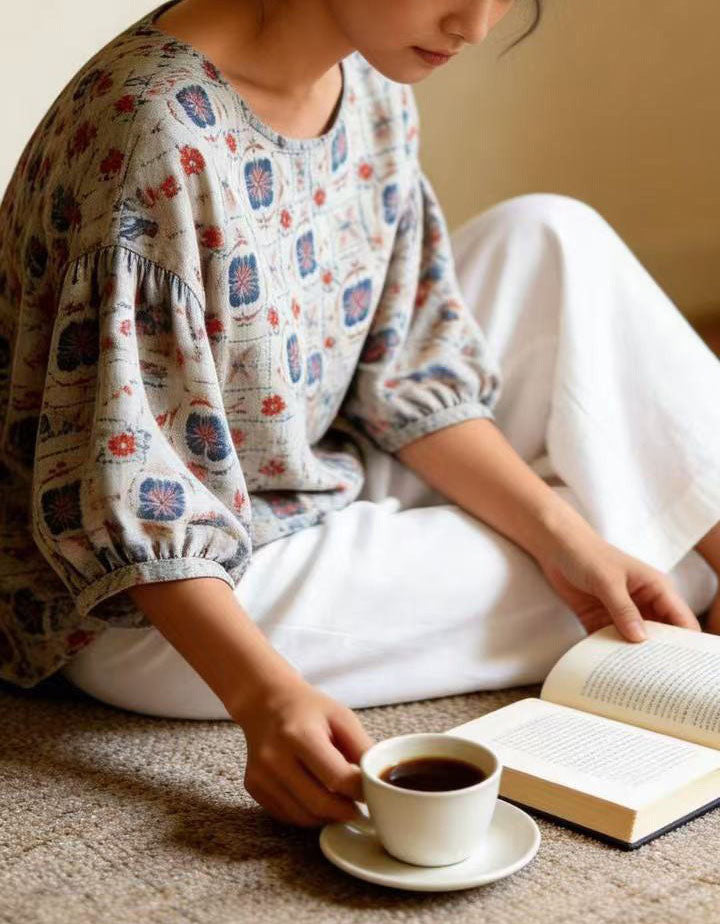 Woman wearing vintage floral linen blouse