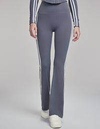 Gray leggings with white stripes on a plain background