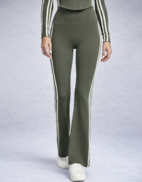 Green pants with white stripes worn by a person on a light gray background