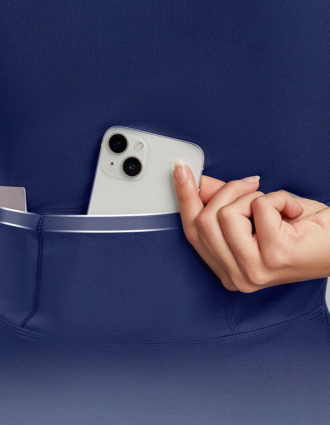 Person placing a phone into a blue pocket against a matching background