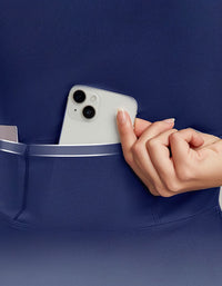 Person placing a phone into a blue pocket against a matching background