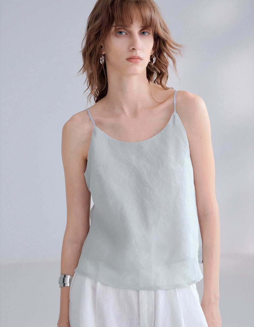 Summer linen top layered with white pants and accessories