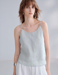 Summer linen top layered with white pants and accessories