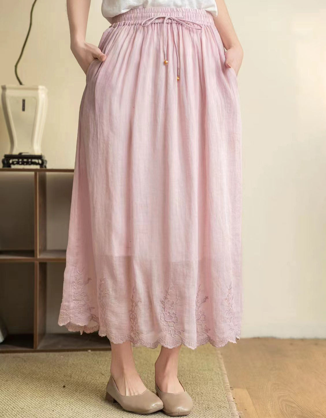 Pink midi skirt with elastic waistband and drawstring detail