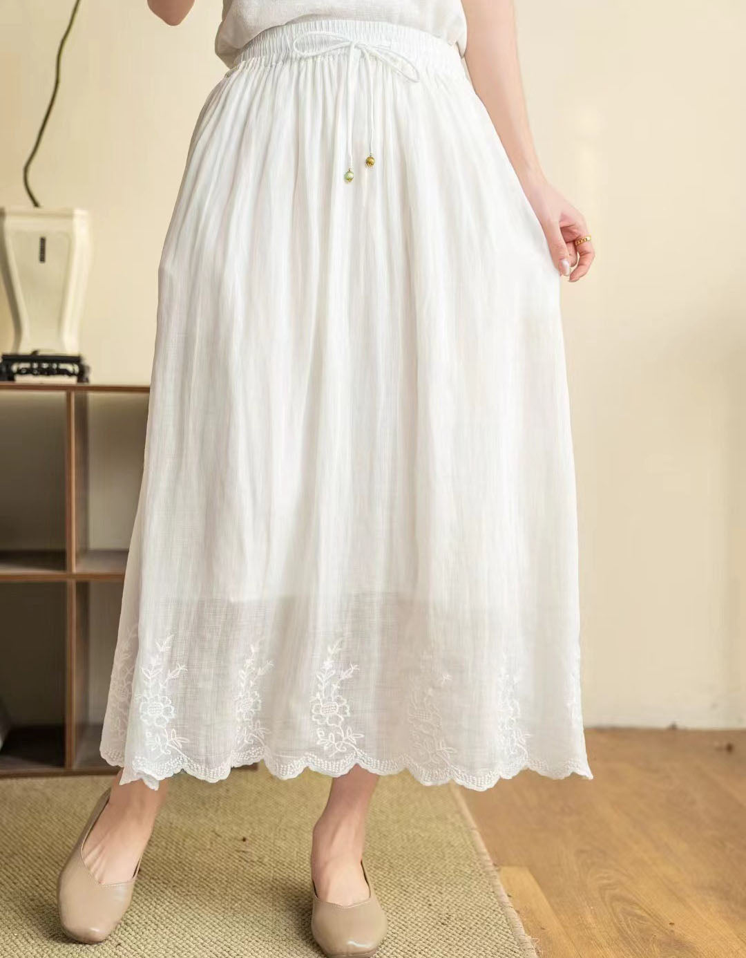 Women’s summer skirt in pastel white with flowy silhouette