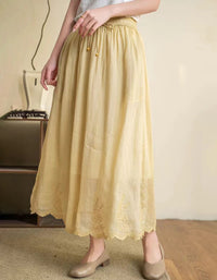 Boho style embroidered midi skirt paired with neutral flats