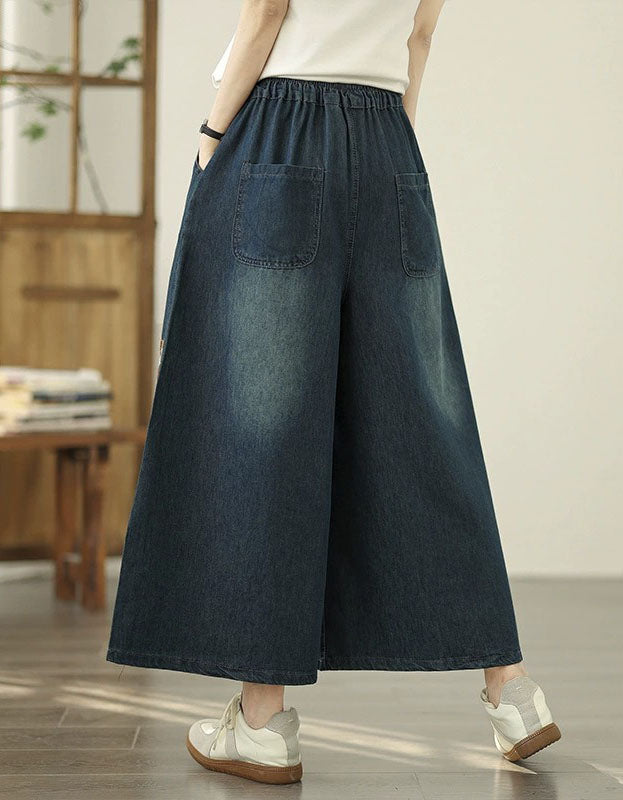Women’s embroidered denim wide leg pants featuring a butterfly and floral design