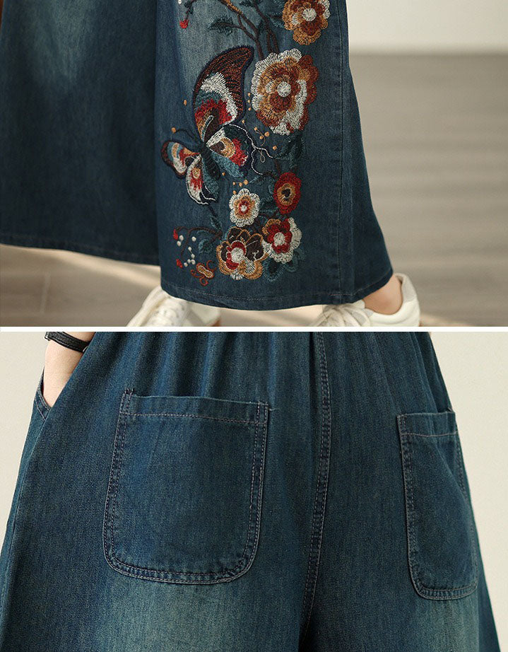 Embroidered denim pants showing butterfly and floral design