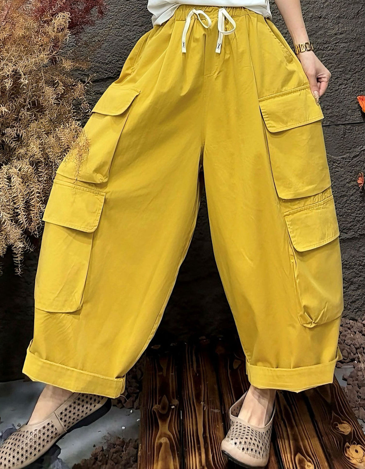 High waist yellow cargo pants with drawstring and large side pockets