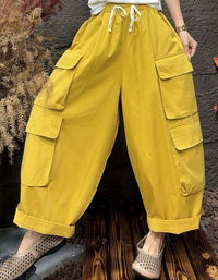 High waist yellow cargo pants with drawstring and large side pockets