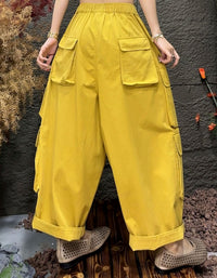 Back view of casual outfit with yellow cargo trousers and relaxed fit design