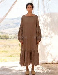 Women wearing brown linen maxi dress with puff sleeves