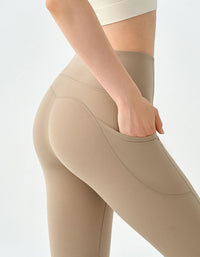 Women’s athleisure leggings with phone pocket beige back view