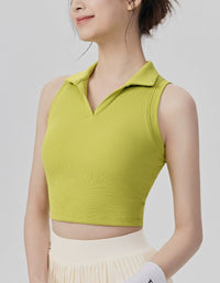 Woman wearing a green sleeveless top against a plain background
