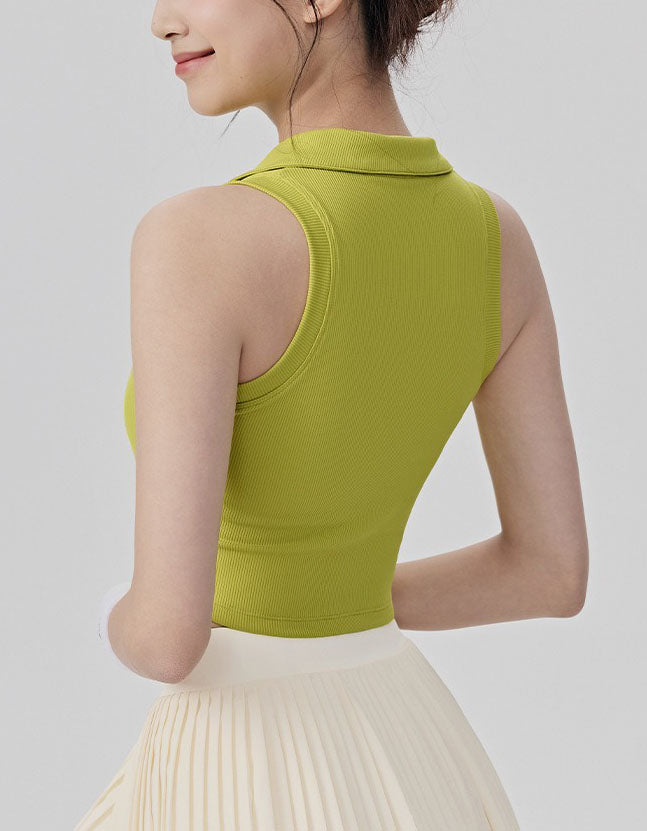 Woman wearing a green sleeveless top against a plain background back view