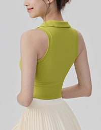 Woman wearing a green sleeveless top against a plain background back view