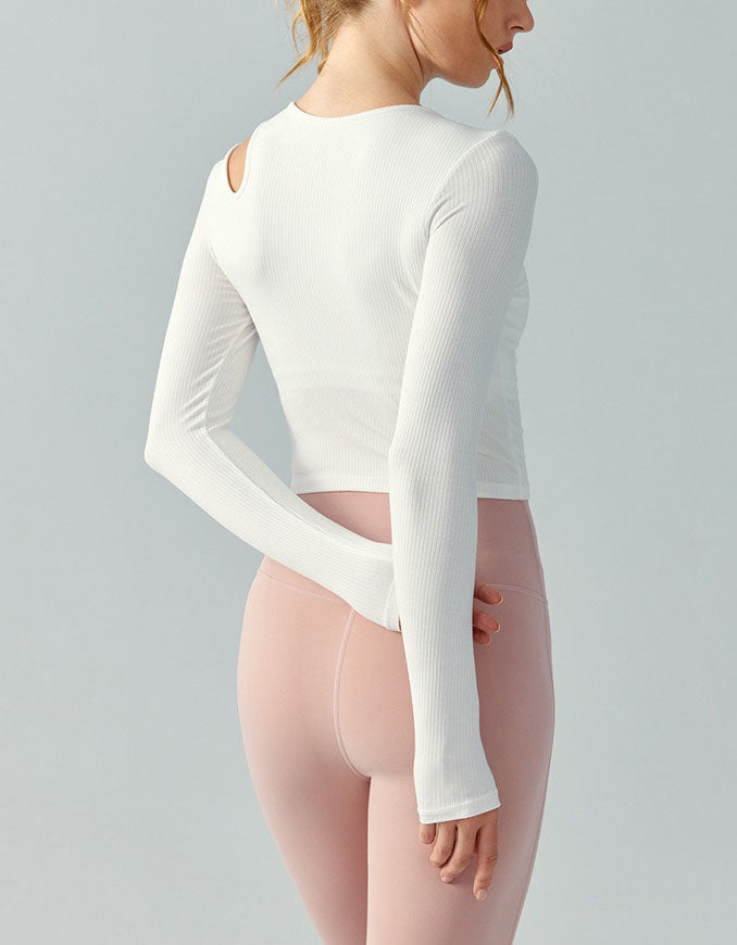 Person wearing a white long-sleeve top on a gray background back view