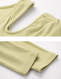 Close-up of a light green ribbed sweater on a white background