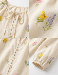 Floral embroidered detail on women cotton peasant blouse