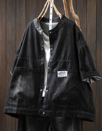 Vintage black denim jacket with button closure and pockets