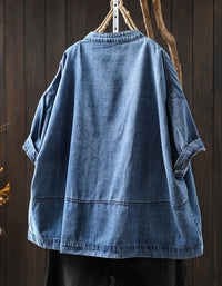 Vintage blue denim jacket with button closure and pockets back view