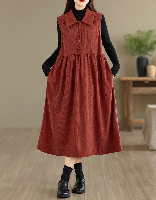 Women’s rust red sleeveless midi dress with button front and loose fit