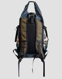 Backpack with floral pattern on a light gray background