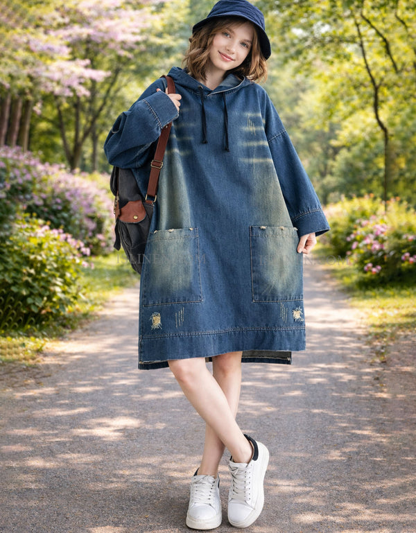 Women wearing oversized denim hoodie dress with front pockets