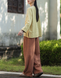 Loose fit yellow linen cotton blouse with stitch detail back view