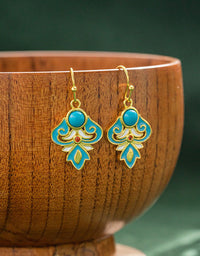 Elegant drop earrings with turquoise and enamel design, ideal for accessorizing outfits