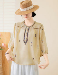 Women’s loose fit boho top styled with skirt and straw hat