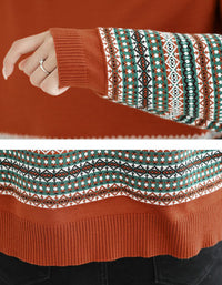 Close-up of a sweater with a patterned sleeve and orange-colored.