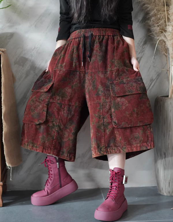 Red floral corduroy wide leg cargo culotte pants with elastic drawstring waist.
