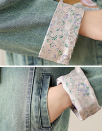 Close-up of women’s embroidered denim jacket with floral detailing and a stylish drawstring