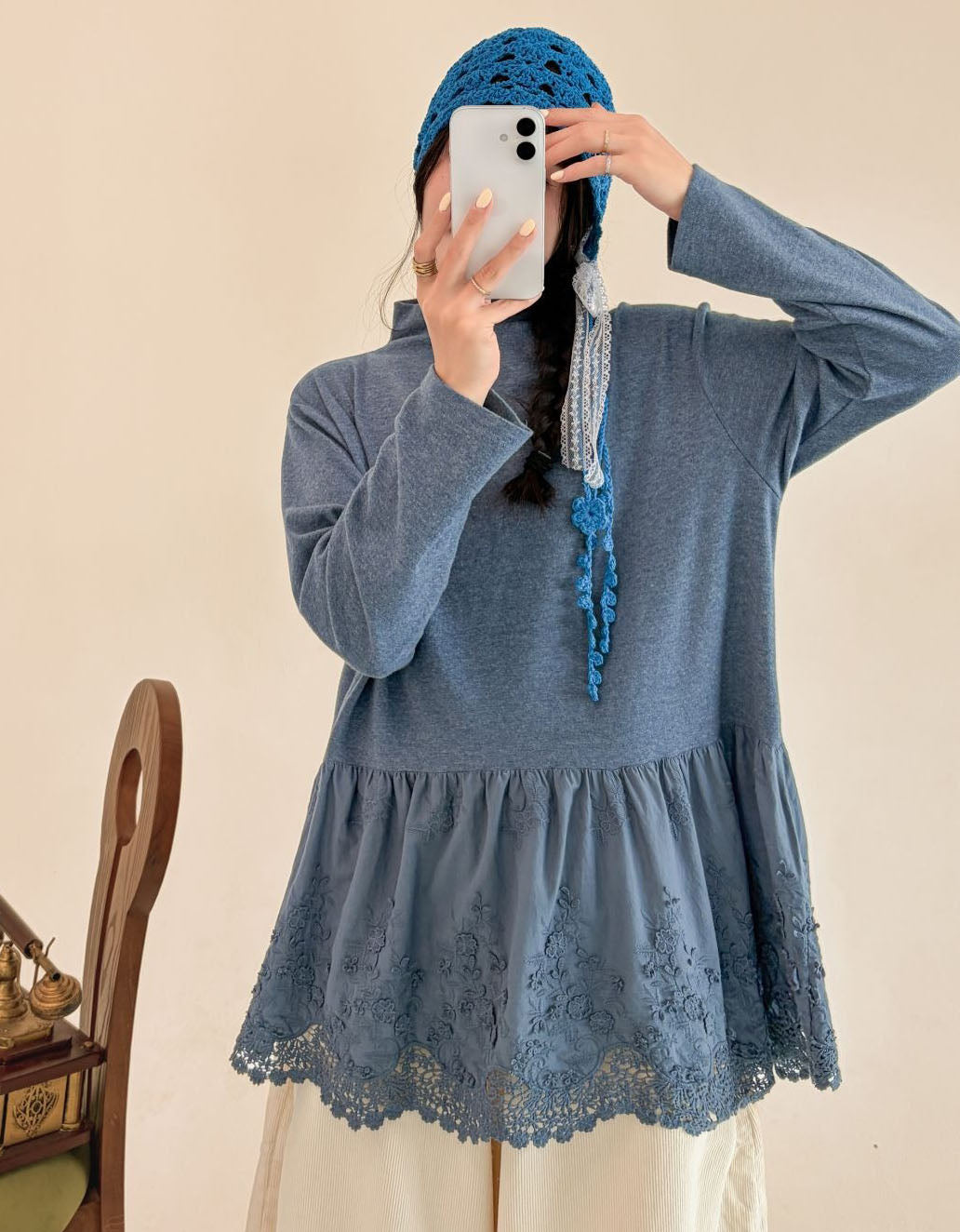 Women's blue long sleeve tunic with a gathered hem