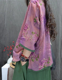 Women wearing vintage floral linen jacket with frog buttons pink side view