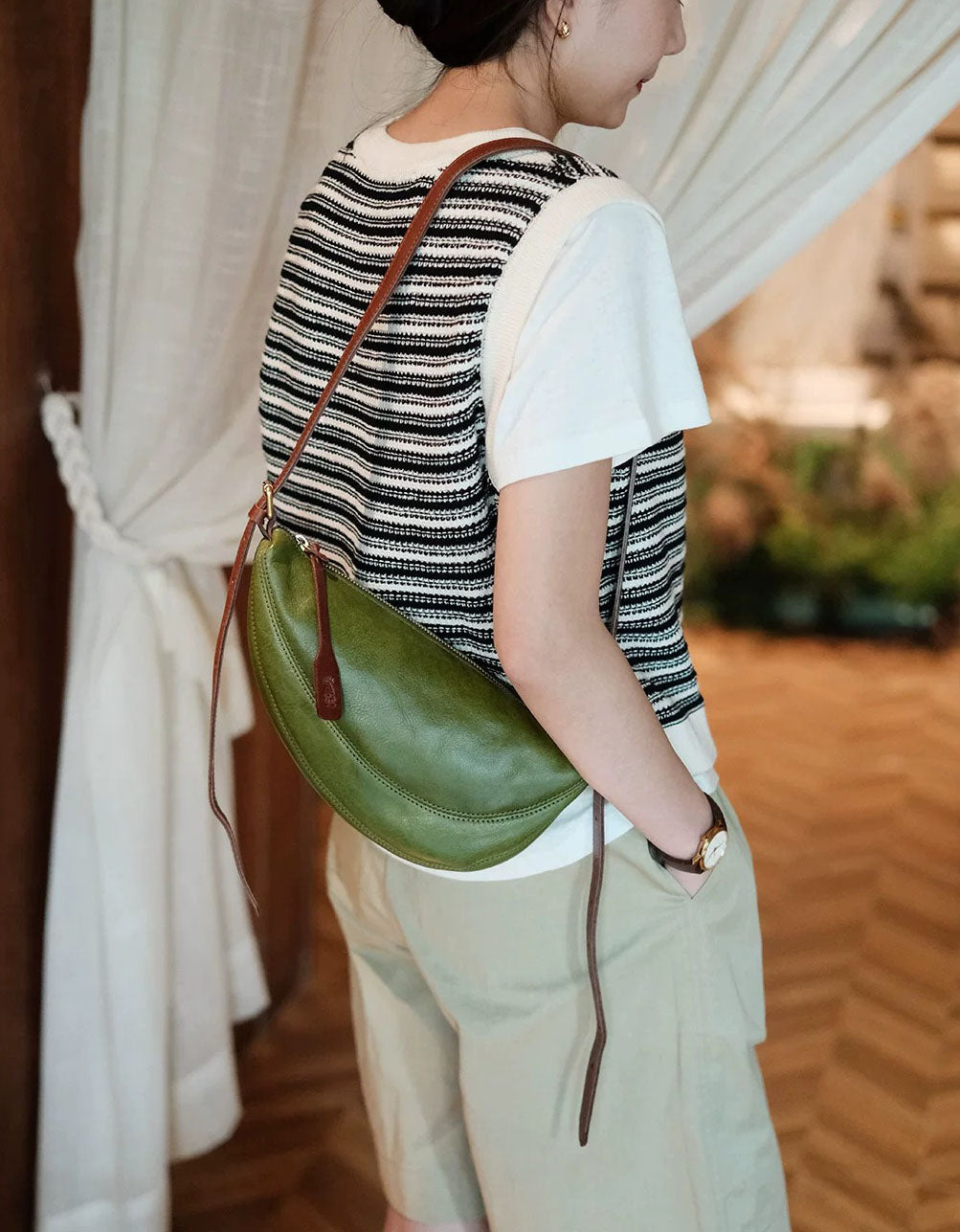 Minimalist olive green leather shoulder purse styled as everyday casual crossbody handbag