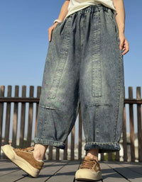 Side view baggy wide leg denim jogger pants styled with casual tee and sneakers in flat lay outfit
