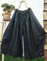 Women's loose cropped denim trousers with elastic drawstring waist and casual everyday look