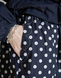 Details of comfortable women’s linen pants with classic polka dot pattern